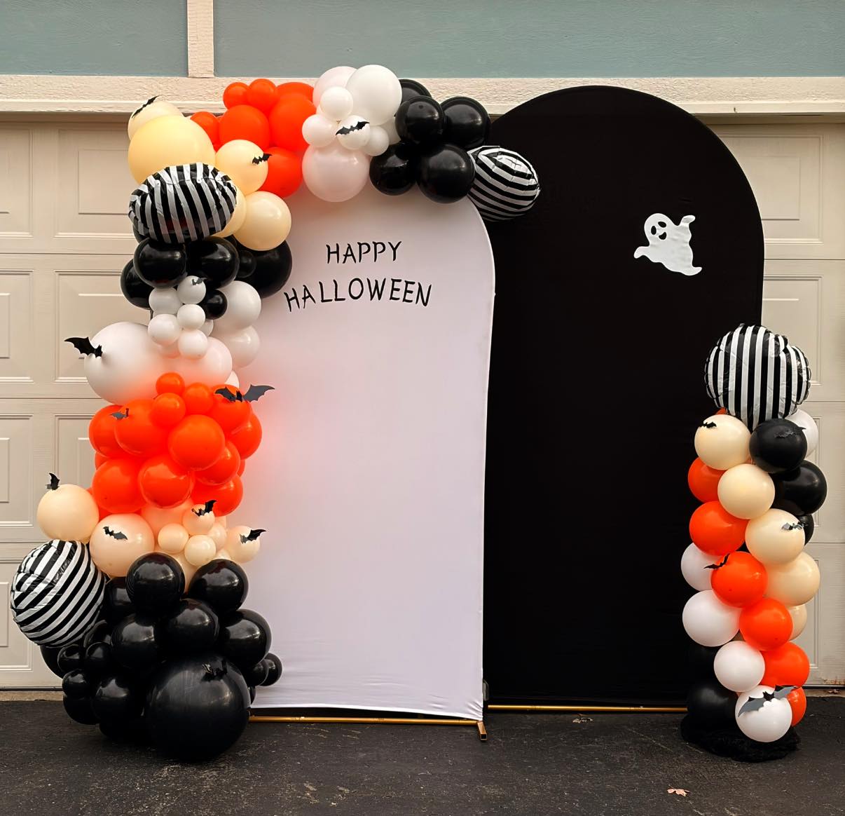 Halloween themed balloon arch and balloon column with chiara backdrops and custom vinyl.