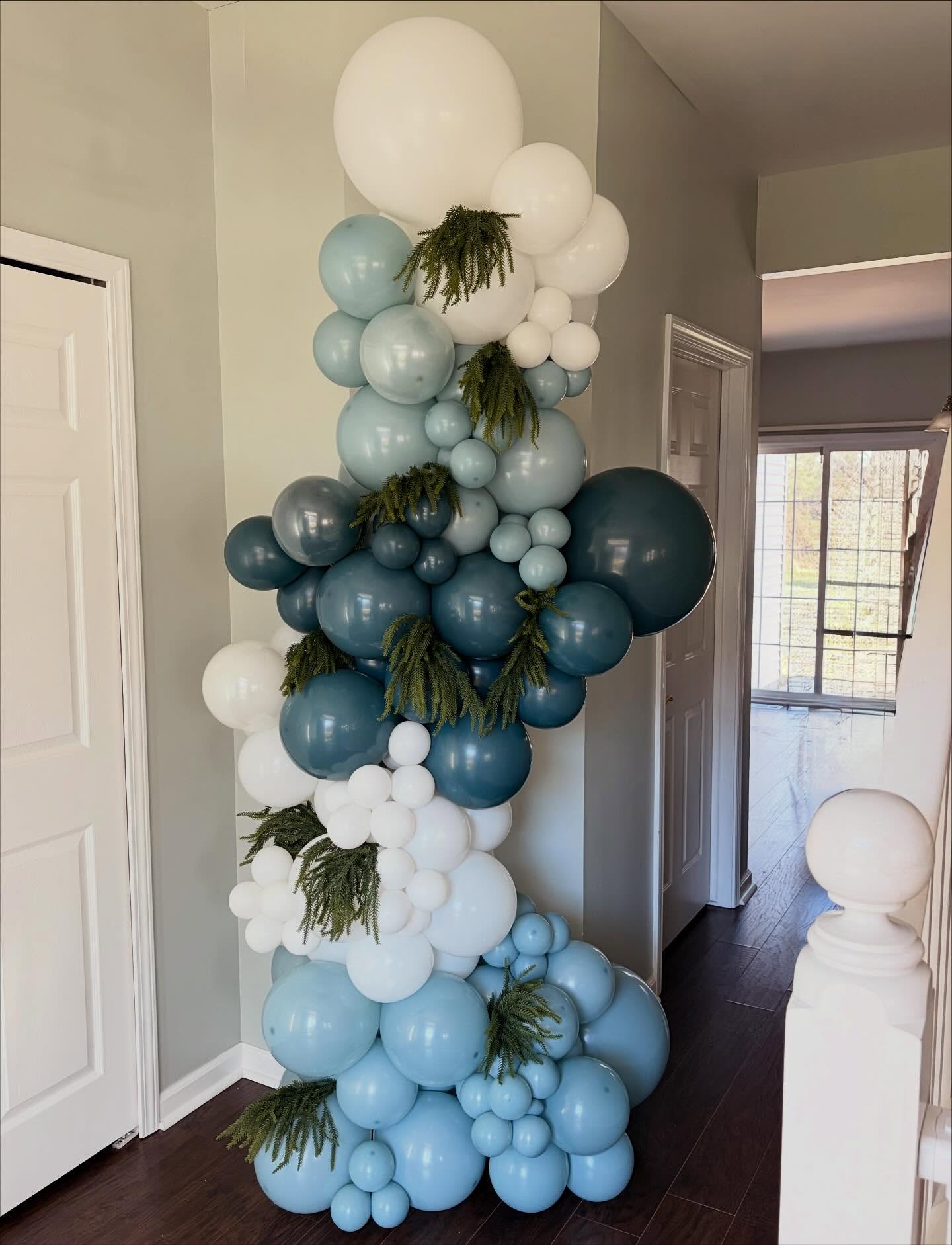 Blue and white freestanding balloon garland arch.